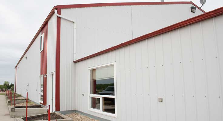 Large white and red garage building